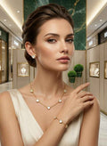 Gold heart charm necklace set with three heart pendants on model