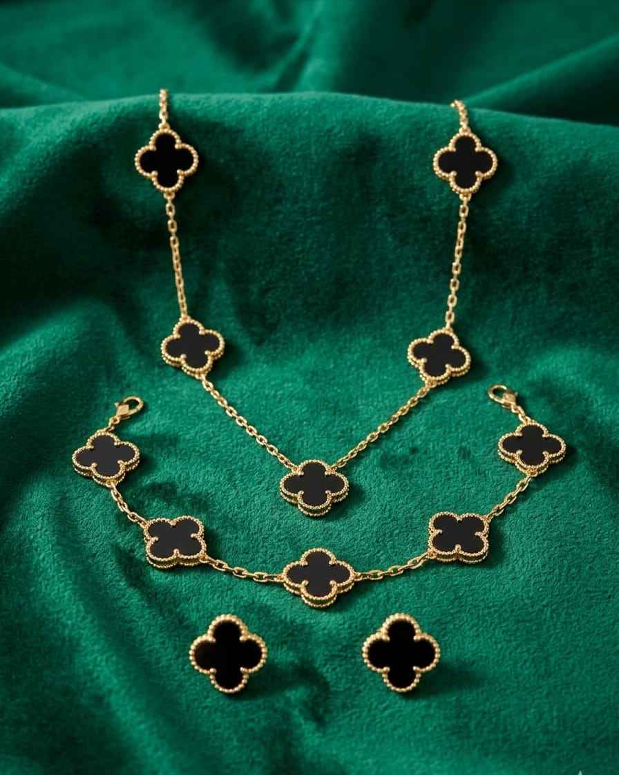 Gold-tone clover jewelry set: chain necklace with matching drop earrings