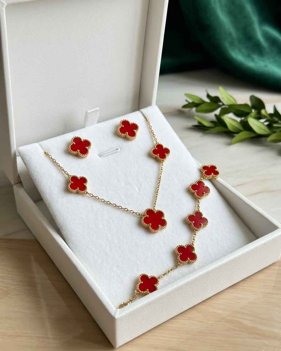 Gold-tone red clover necklace and red clover stud earrings in gift box