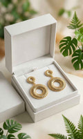 Gold textured double circle drop earrings with inner hoop and outer ring, in a gift box
