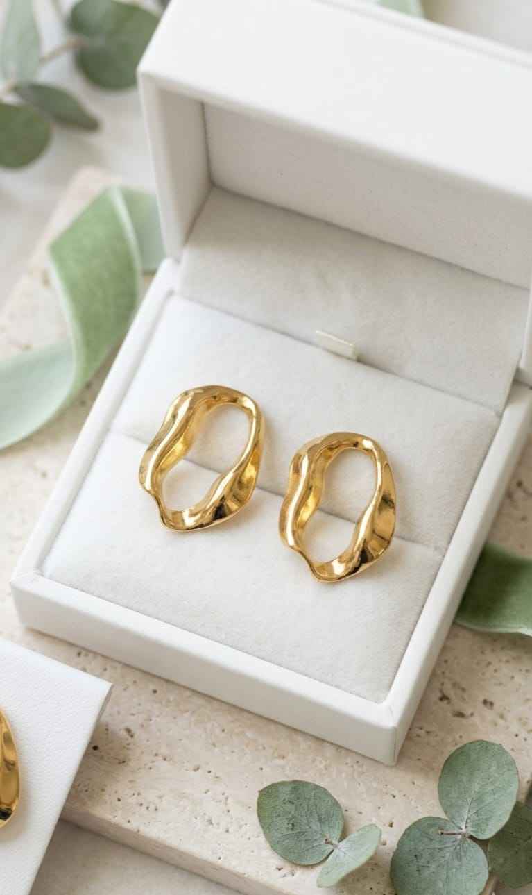 Gold open-shape hoop stud earrings in gift box, curved oval textured design