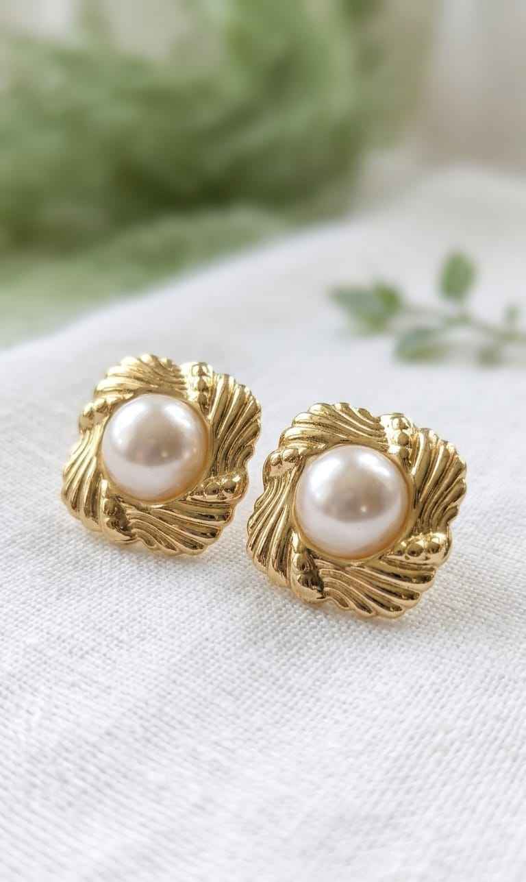 Pearl floral stud earrings with gold-tone ornate leaf frames and round white pearls